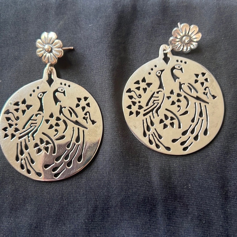 Gorgeous, silver Mexican earrings. Intertwined love birds etched on silver.